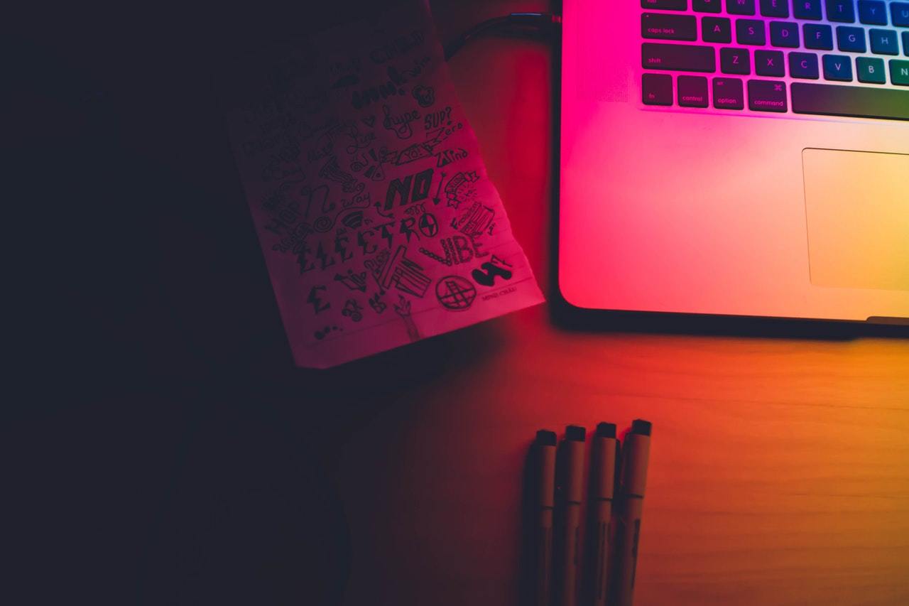 Laptop bathed in coloured light
