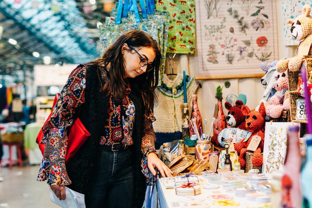 Women browsing market stall