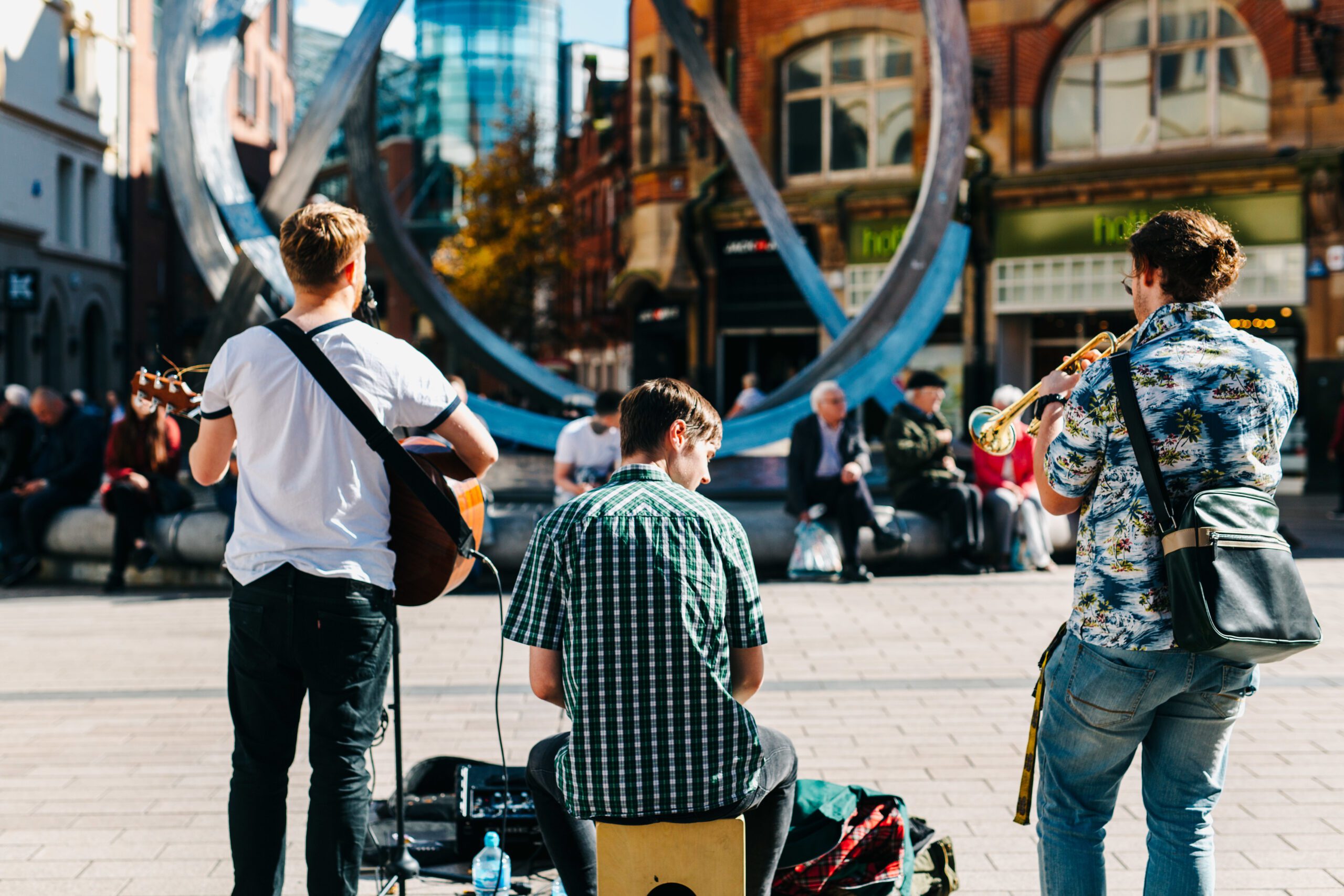 Three musicians busking in Belfast
