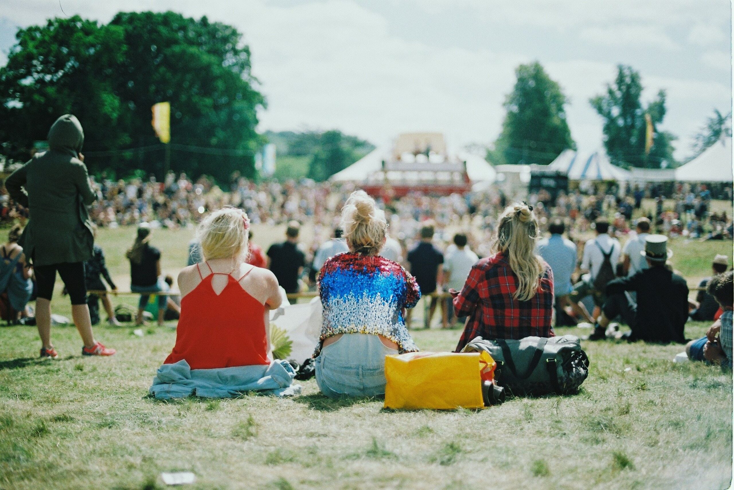 Three woman at an outdoor festival