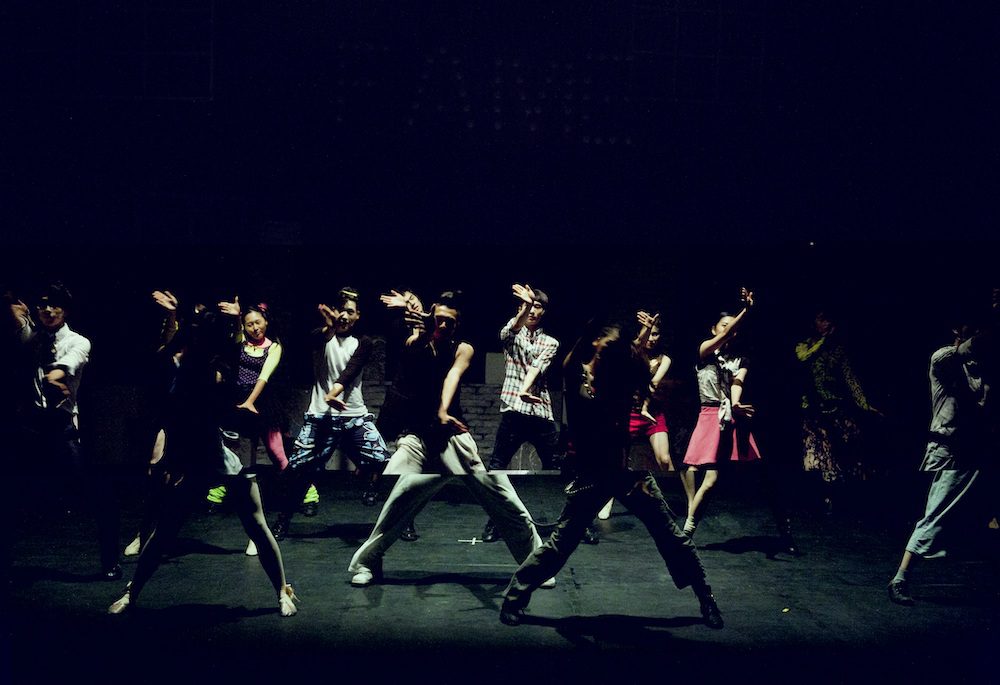 Dancers on a dark stage