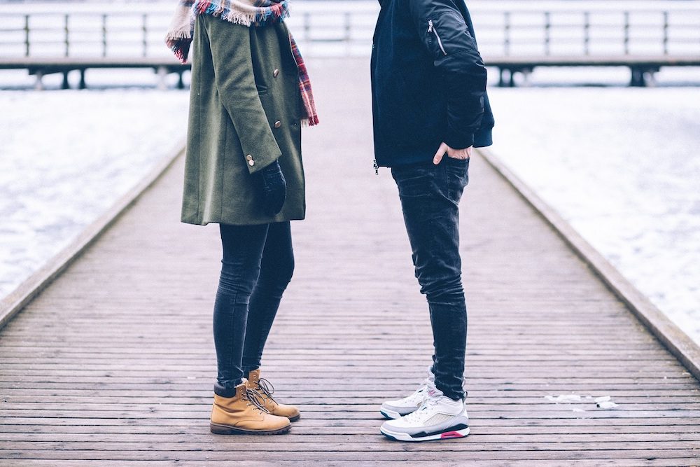 Couple standing on a pier