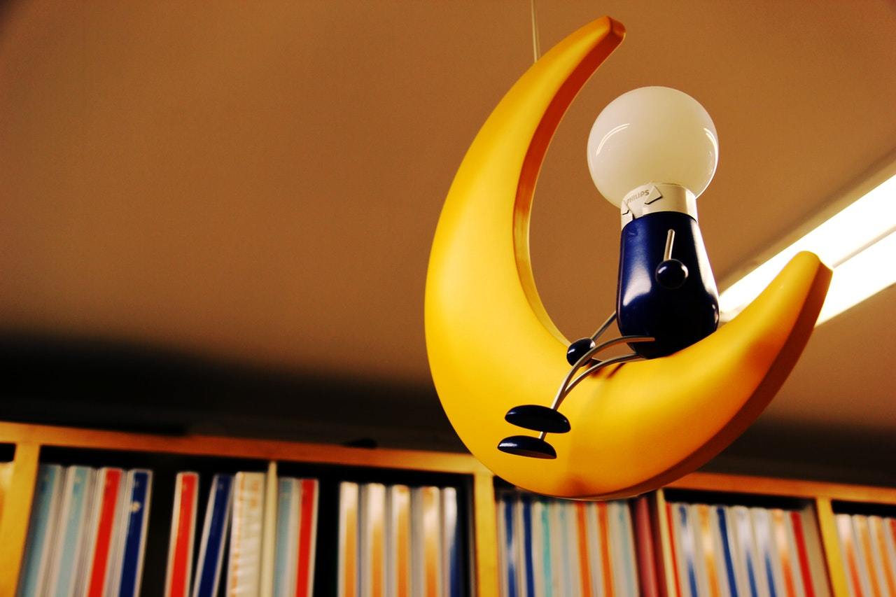 Moon shaped light in a library