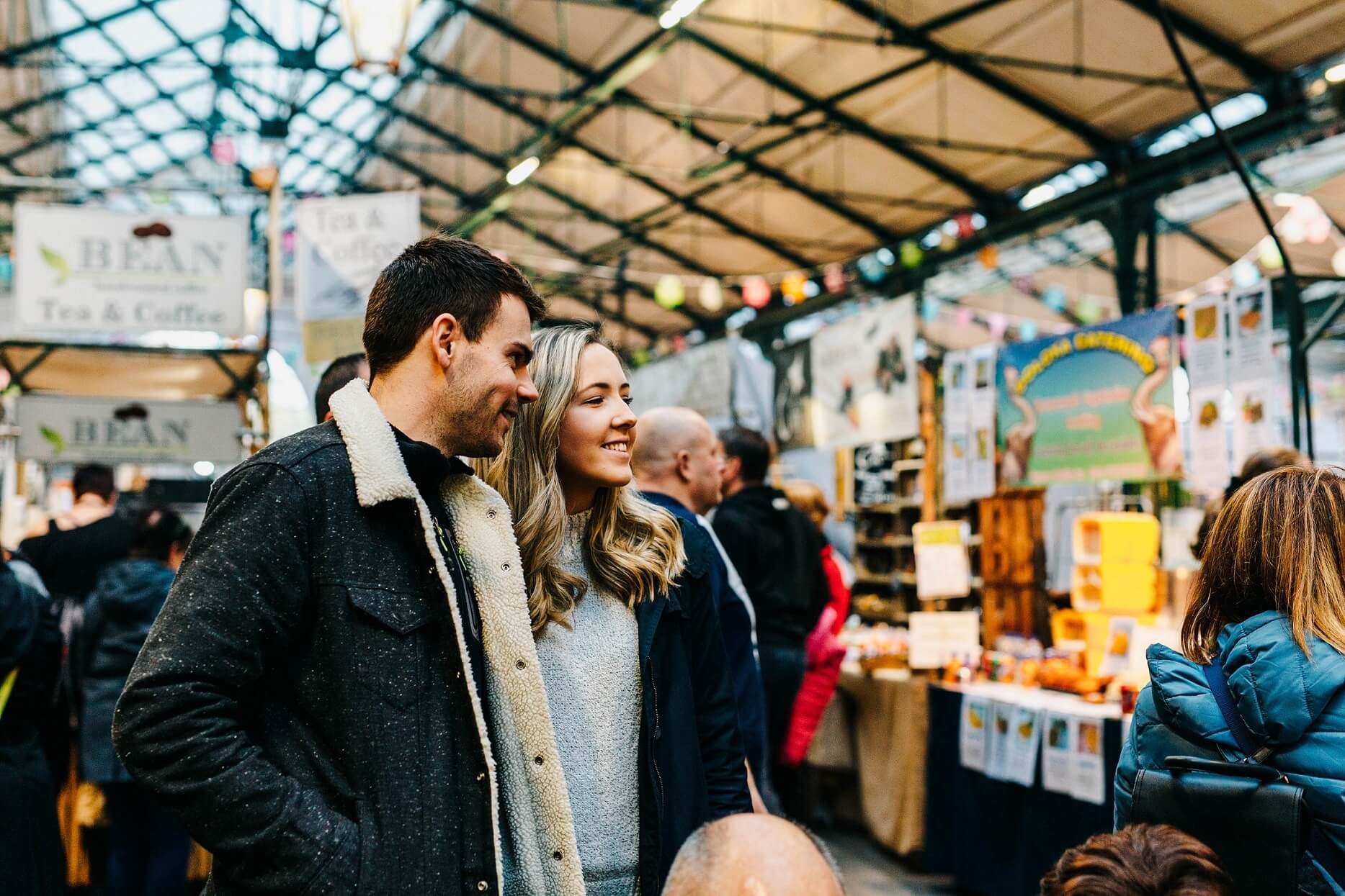 A couple looking at market stalls