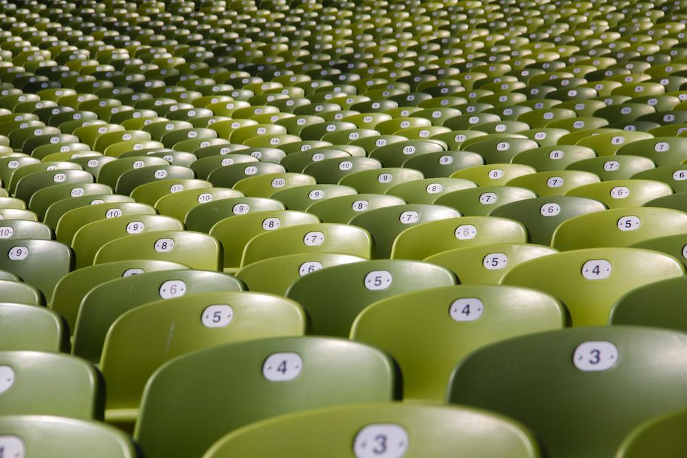 Numbered green seats in stadium