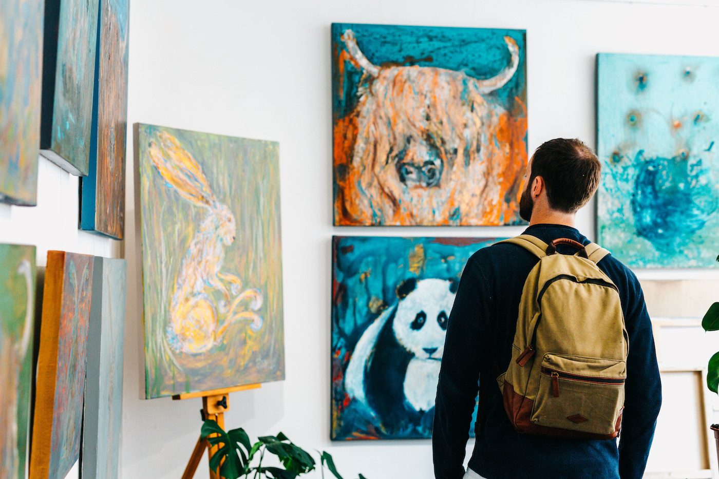 Man looking at art in a art gallery