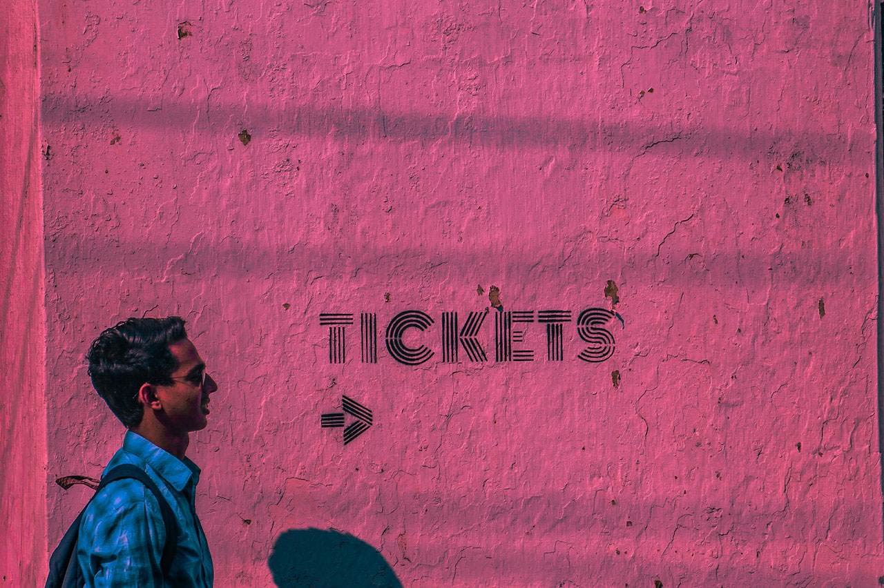 Man walking by tickets