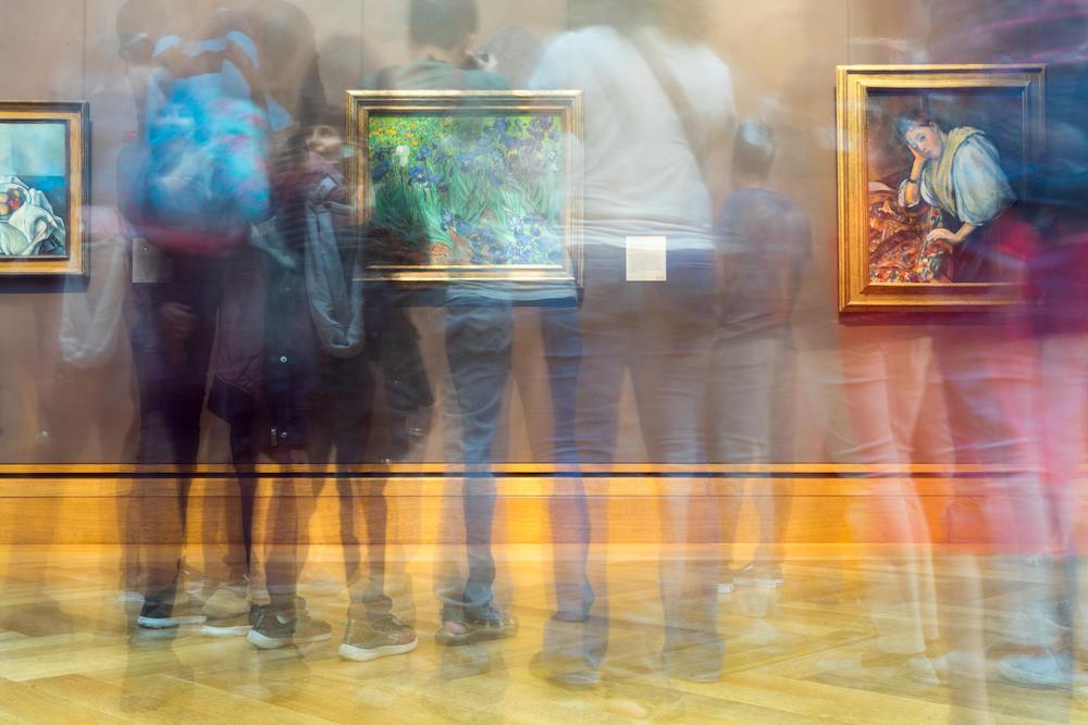 People looking at paintings