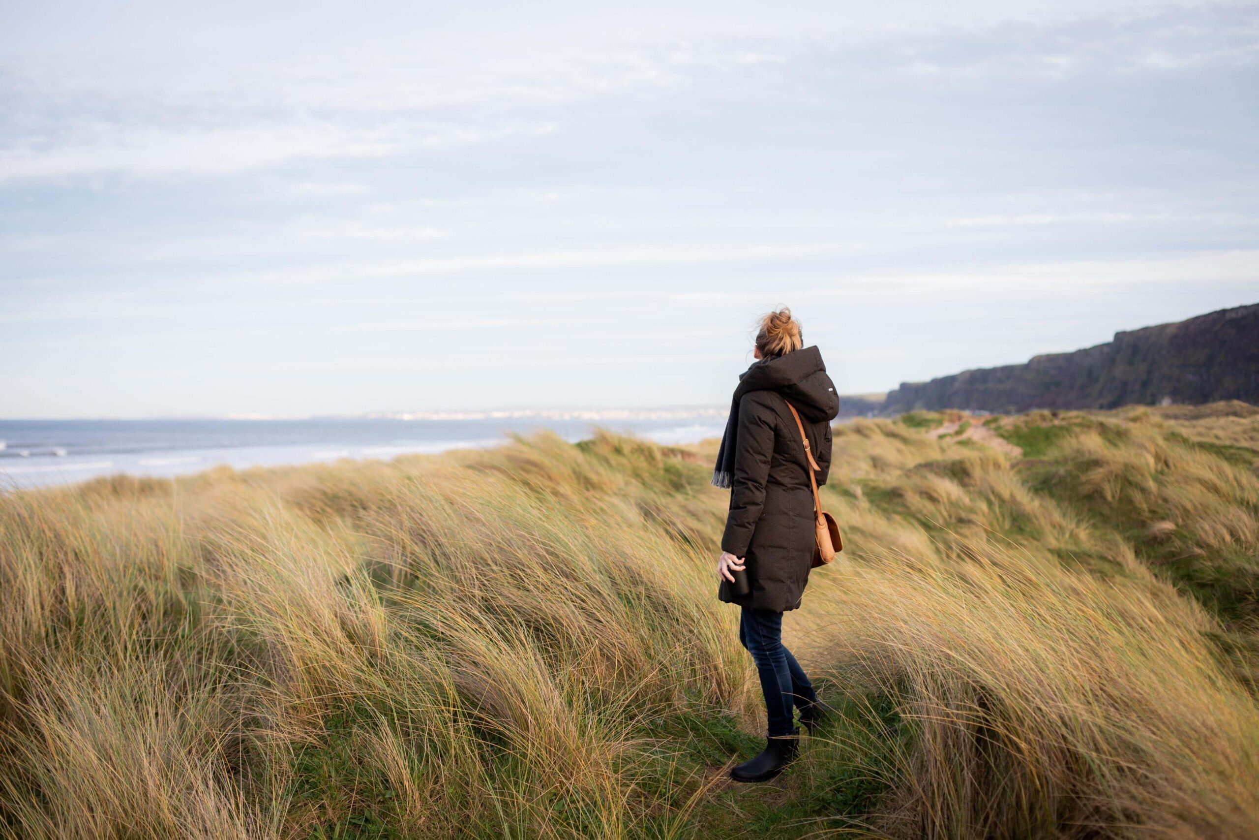 Woman standing in a grassland