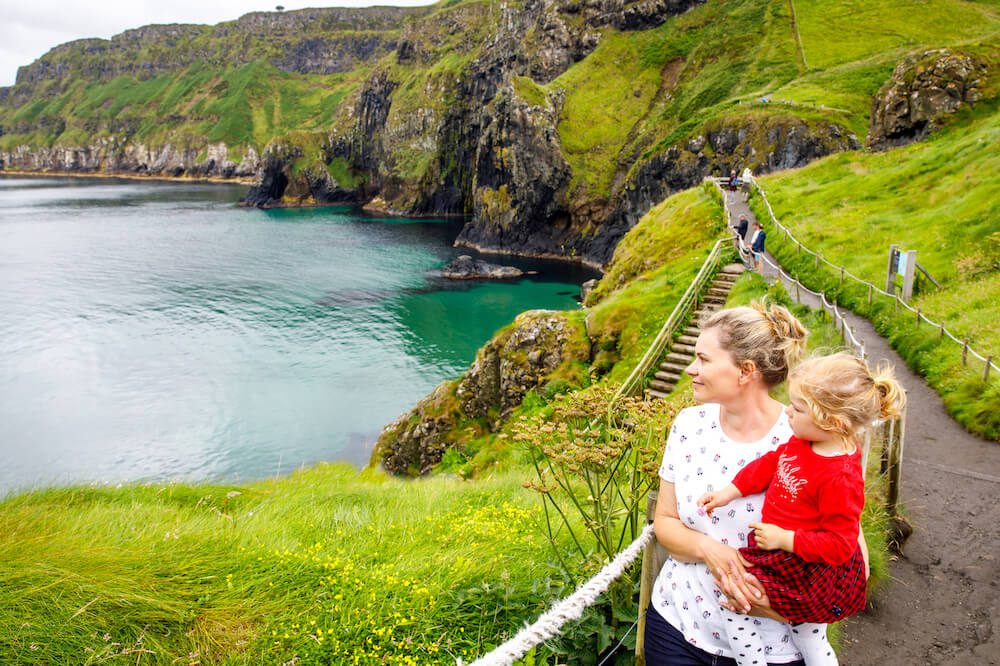 Toddler girl and mother on Carrick-a-Rede rope bridge