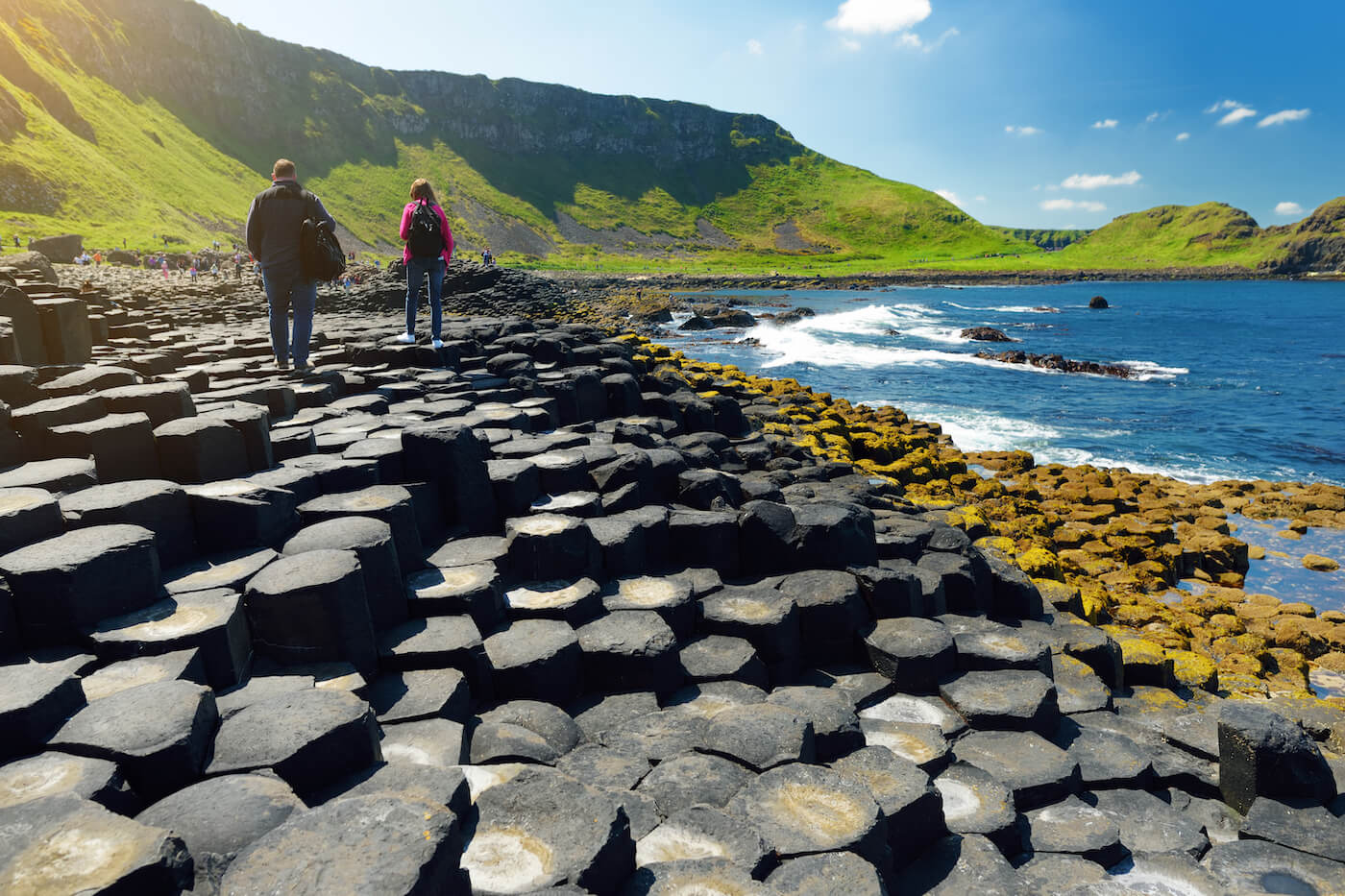 Tourists walking at the Giants Causeway