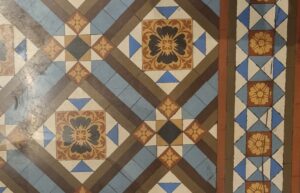 Close-up view of original tile in the Court Room