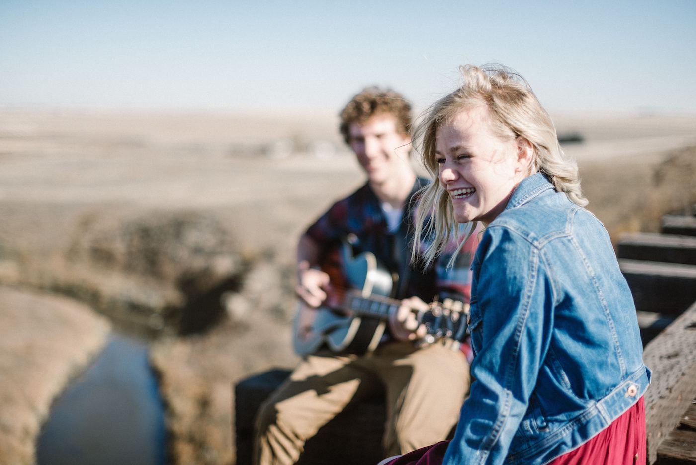 Friends hanging out and playing guitar