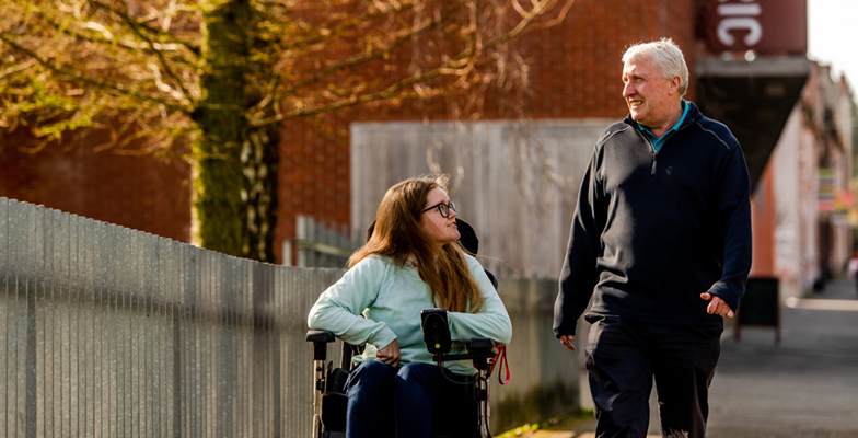 Two people outside the Lyric Theatre